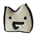 Smiling Milo Plushie with a cream-colored face, black outline, round eyes, and a playful smile